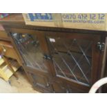 A Small Oak Leaded and Glazed Bookcase with cupboards below