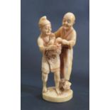 An Antique Oriental Ivory Okimono of Two Men, signed to the base, 12.5cm