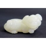 A Chinese Carved Jade Recumbent Dog, 47mm long