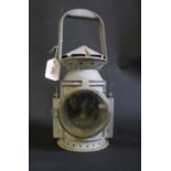 A Grey Overpainted Railway Lamp with Wakefield 1945 plaque and stamped with crow's foot