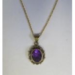 A 9ct Gold Amethyst Pendant (23mm) on 51cm chain, 2.7g