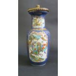 An 18th Century Chinese Famille Verte Vase, drilled and converted to a lamp, 18cm. Rim cracked.