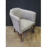 A Small Upholstered Tub Chair