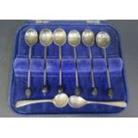 A Cased Set of Six Silver Coffee Bean Finial Spoons and two plated salt spoons, 42g