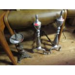A Pair of Fire Dogs, pricket candlestick and brass charger