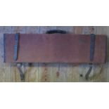 A Canvas and Leather Mounted Shotgun Case with cleaning rod