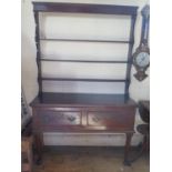 An 18th Century Oak Dresser with associated rack, 127(w)x200(h)cm. Back legs missing and other