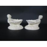 A Pair of Royal Worcester Merboy and Scallop Shell Salts, 9.5cm tall