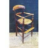 A Victorian Mahogany Caner Seated Child's High Chair. Old worm to arm