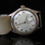 A BAUME 9ct Gold Wristwatch with 17 jewel movement, 30mm case no. 392344, running