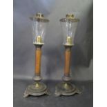 A Pair of 19th Century Brevete Spelter and Leather Lamps with original glass shades, 41cm high