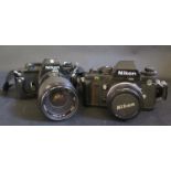 A Nikon F3 35mm Camera with Nikon 50mm 1:1.8 Lens and EM 35mm Camera with Vivitar 35-70mm zoom