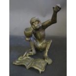 A Bronze Monkey with book, c. 13.5cm high