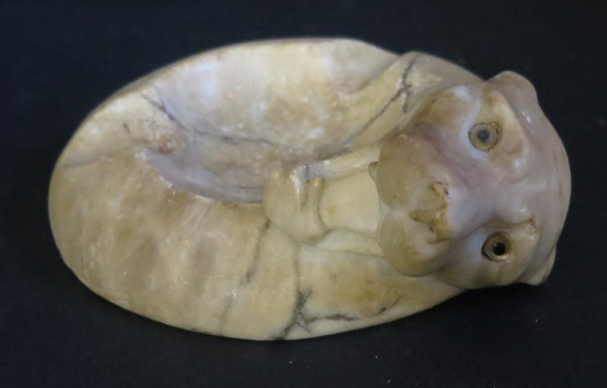 A Marble Ashtray carved with the head of a big cat with glass eyes, 14.5cm
