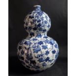 A Chinese Republican Period Blue and White Porcelain Double Gourd Vase painted with gourds,