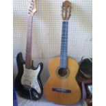 An HOKADA Model 3151 Classical Guitar and Rocket Deluxe electric guitar (A/F)