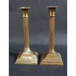A Pair of 19th Century Brass Corinthian Column Candlesticks with detachable sconces, 25.5cm