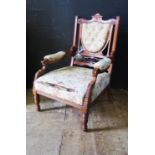 An Edwardian Carved Open Arm Chair and bag of loose castors
