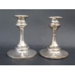 A Pair of Loaded Silver Candlesticks, 11.5cm tall