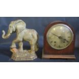 A Cast Iron Elephant Door Stop and damaged oak cased mantle clock