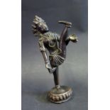 An Indian Bronze Figure of Hindu Figure with raised leg and standing on lotus blossom, 15cm