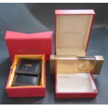 A Cased SJ Dupont Gold Plated Travel Alarm and leather sleeve