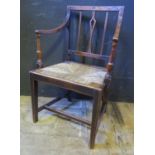An 18th Century Carved Oak Carver Chair with drop in rush seated seat