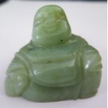 A Carved Jade Seated Buddha
