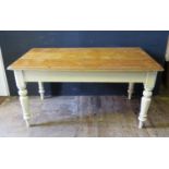 A Victorian Pine Farmhouse Table with three plank top, single end frieze drawer and baluster