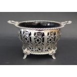 An Elizabeth II Silver Two Handled Bowl with pierced foliate decoration and a blue glass liner,