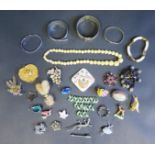A Selection of Costume Jewellery including brooches and bangles