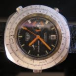 An HEUER Automatic Calculator Wristwatch with Cal. 15 movement, fluorescent orange hands and rare