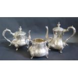 A Silver Plated Rococo Three Part Tea Set