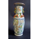An Early 19th Century Chinese Famille Verte Vase decorated with numerous scenes with figures and