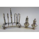 A London Silver Toast Rack A/F and Birmingham 1918, silver pepper and salt 153g.