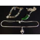 A Silver and Nephrite 'Tiger's Claw' Pendant Necklace, silver gate link bracelet and silver Taurus