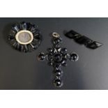 A Victorian Black Glass Cross Pendant, 85mm long and other black glass