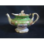 A Victorian Coalport Teapot with floral decoration on a green ground with gilt highlights