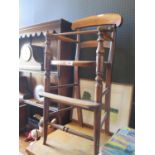 A Victorian Mahogany Cane Seated Child's High Chair. Old worm to arm