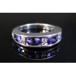 An ILIANA 18ct White Gold, Tanzanite and Diamond Half Hoop Ring, size O, 6.4g