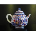 A Small Oriental Lobed Teapot in the Imari pallete, 10.5cm. Hairline to lid