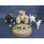 A Border Fine Arts Terrier with hedgehog by D. Geenty two porcelain dog models and a Jointed