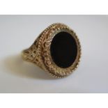A 9ct Gold and Black Onyx Ring, 21mm diam., size O.5, 4.8g