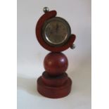 A Stadium 8 Day Bezel Wound Clock in bespoke case, 31cm tall. A/F