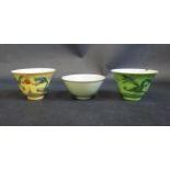 A Pair of 19th Century Chinese Dragon Decorated Tea Bowls, the green with four character mark and