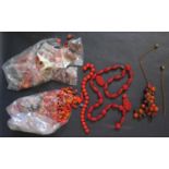 A Chinese Cinnabar Necklace with silver gilt clasp (needs restringing), coral beads (51g,