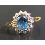 A 9ct Yellow Gold, Blue Topaz and Diamond Ring, size O.5, 2.2g