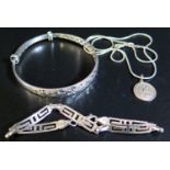 An Adjustable Silver Bangle, silver St. Christopher pendant necklace and silver bracelet, 29g