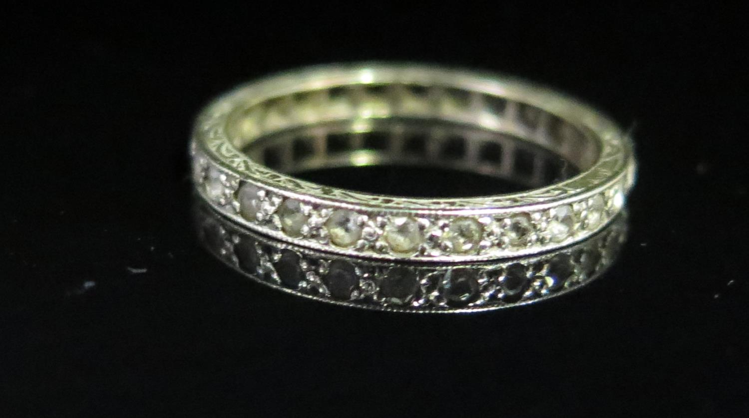 A 9ct Wite Gold and White Stone Set Full Eternity Ring, size P, 2g