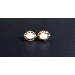 A Pair of Hallmarked 9ct Gold and White Opal Stud Earrings (12x9mm), 1.2g